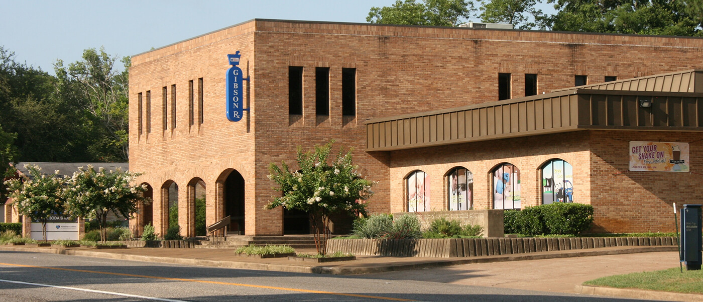 Photo of Gibson Pharmacy building exterior and drive thru